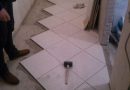that first: to lay tile or install doors