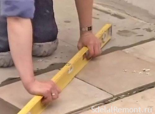 laying tiles on the floor on the diagonal