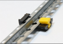 Plastic clip-fastening to plaster beacons